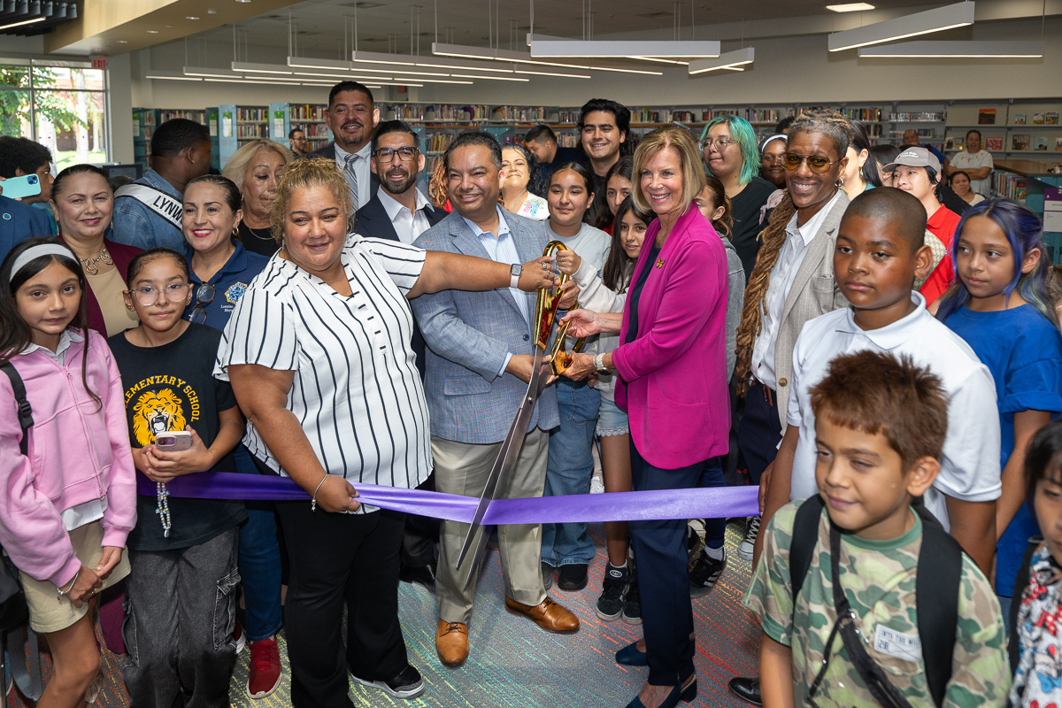 Group ribbon cutting photo featuring Supervisor Hahn and Dr. Skye Patrick