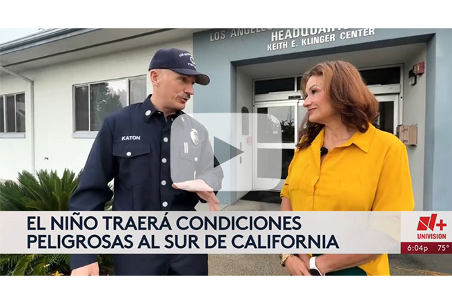 News reporter interviewing firefighter
