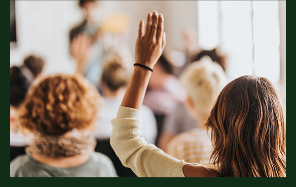 Adult student raising hand