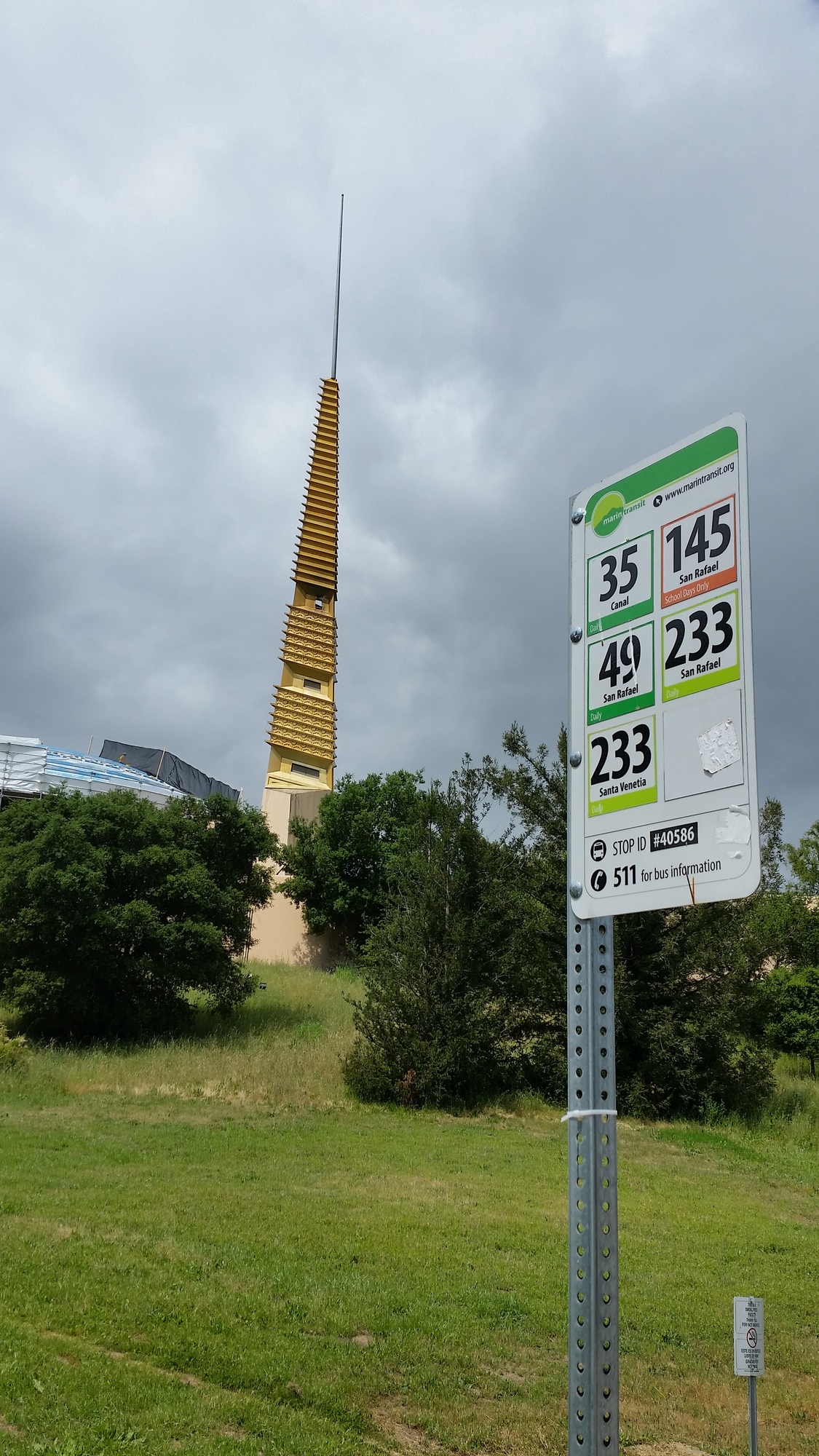 Marin Transit route sign in front of civic center's golden spire