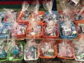 Colorful boxes are filled with supplies and wrapped in cellophane