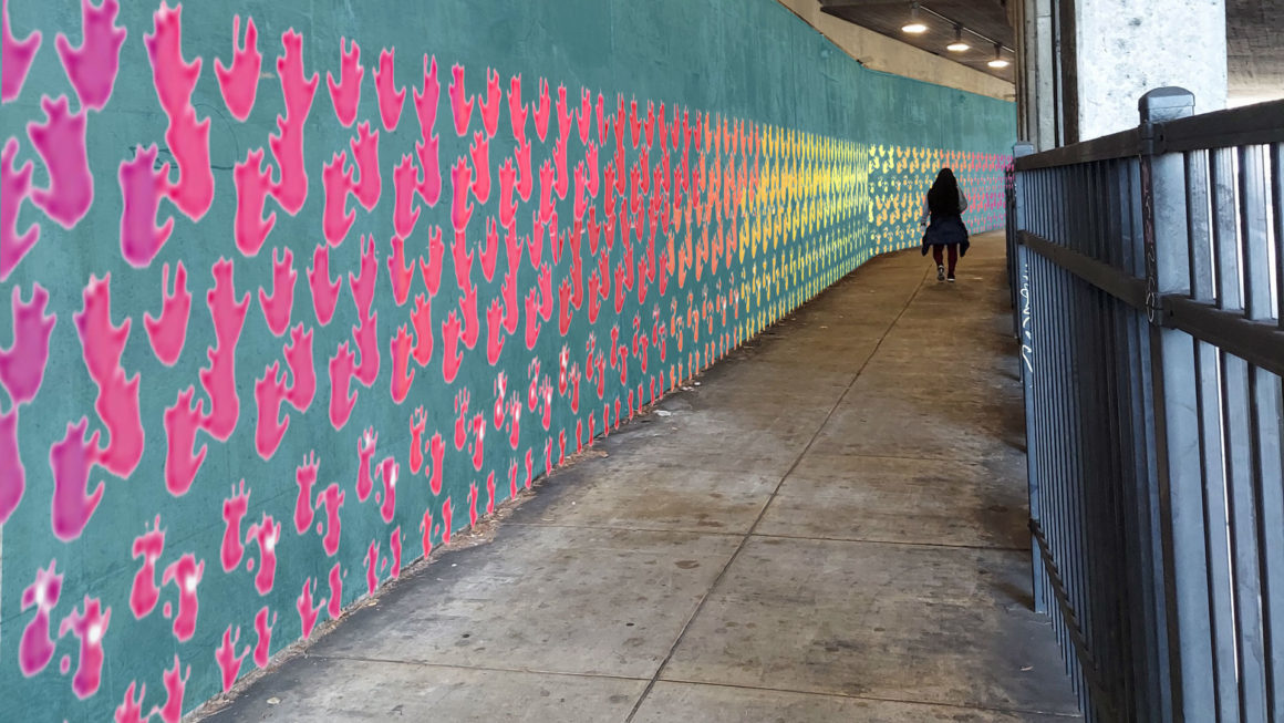 A mock-up of an art installation in the Sausalito-Marin City tunnel, showing multicolored hand prints on the tunnel wall