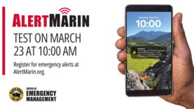 A closeup view of a person's hands holding a cell phone with an AlertMarin message on it.