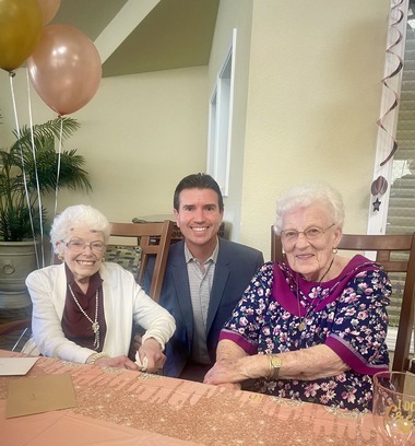 Eric Lucan with Vivian Gordan and Joann Bales at their 100th birthday party