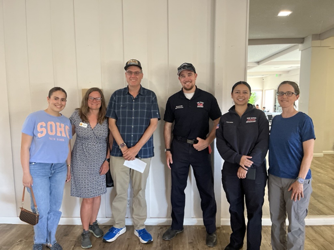 group smiling toward camera in Contempo Clubhouse