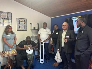 Mary listening to presenters in new space