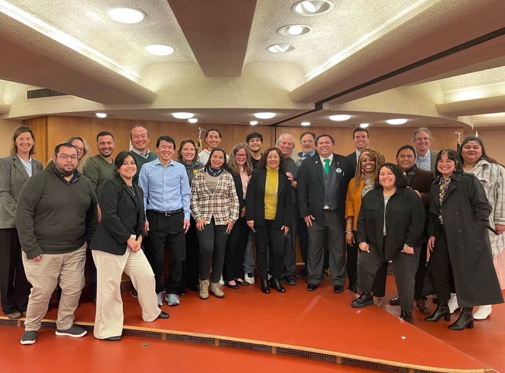 group photo on Board chambers stage smiling