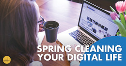 Person organizing digital files on a laptop. The bottom right corner features the text "Spring Cleaning Your Digital Life"