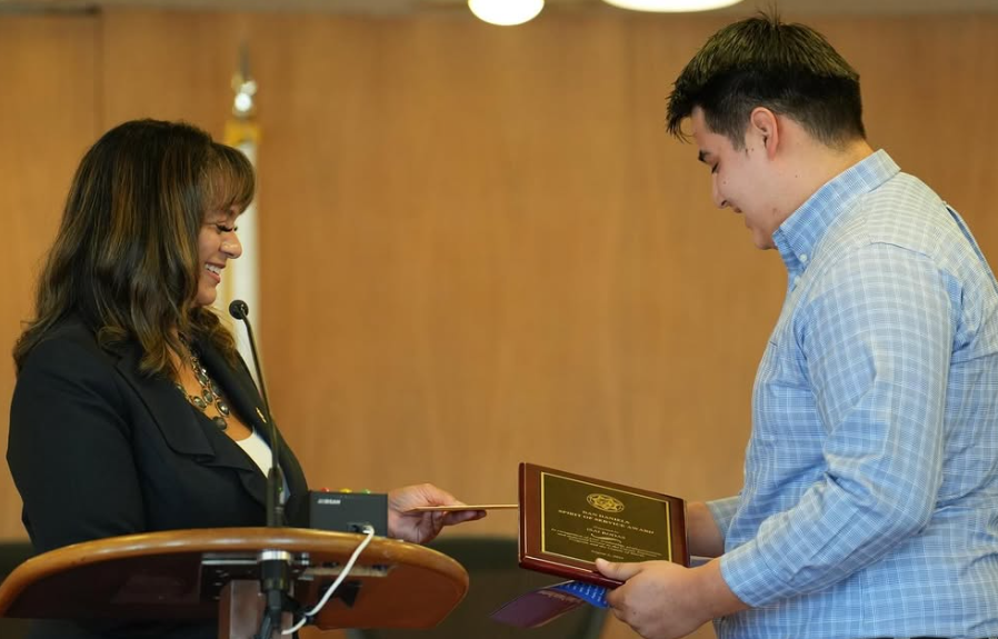 Intern receiving an award