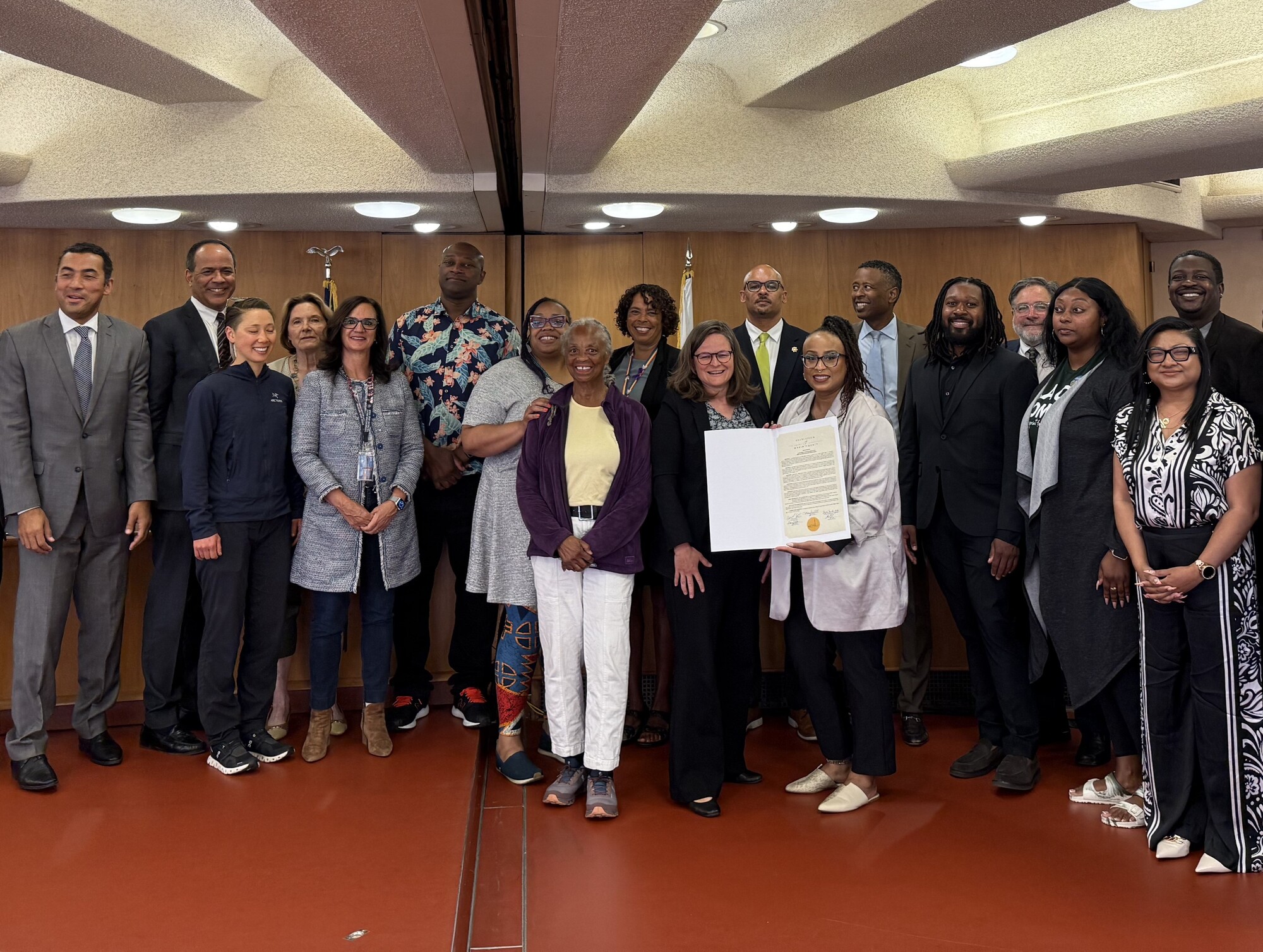 group picture in Board Chambers with COMAE members