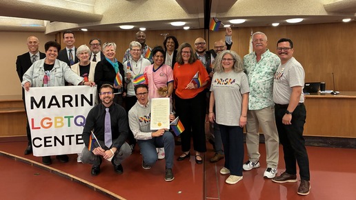 Proclaiming June as LGBTQIA+ Pride Month at the Board of Supervisors meeting with BOS members and community supporters.