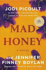 Mad Honey book cover, purple flowers laying on yellow linen