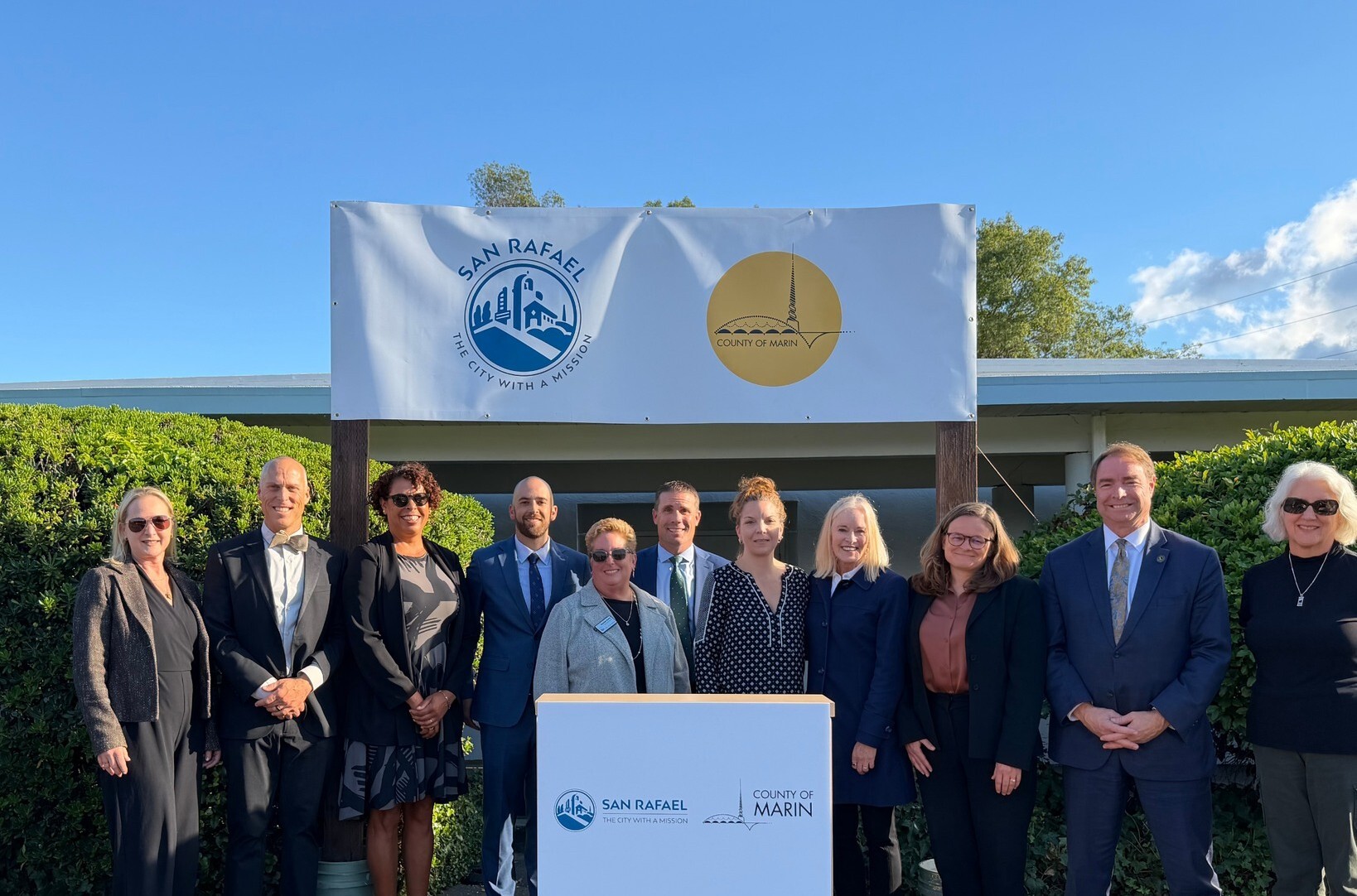 city and county and state representatives at press conference announcement
