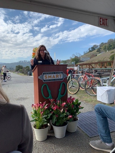Mary speaking at a SMART podium