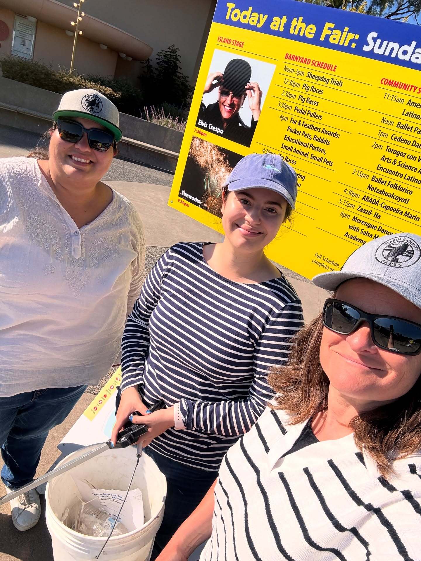 Crystal Martinez, Julia Reinhard and Mary sackett with bucket at the fairgrounds