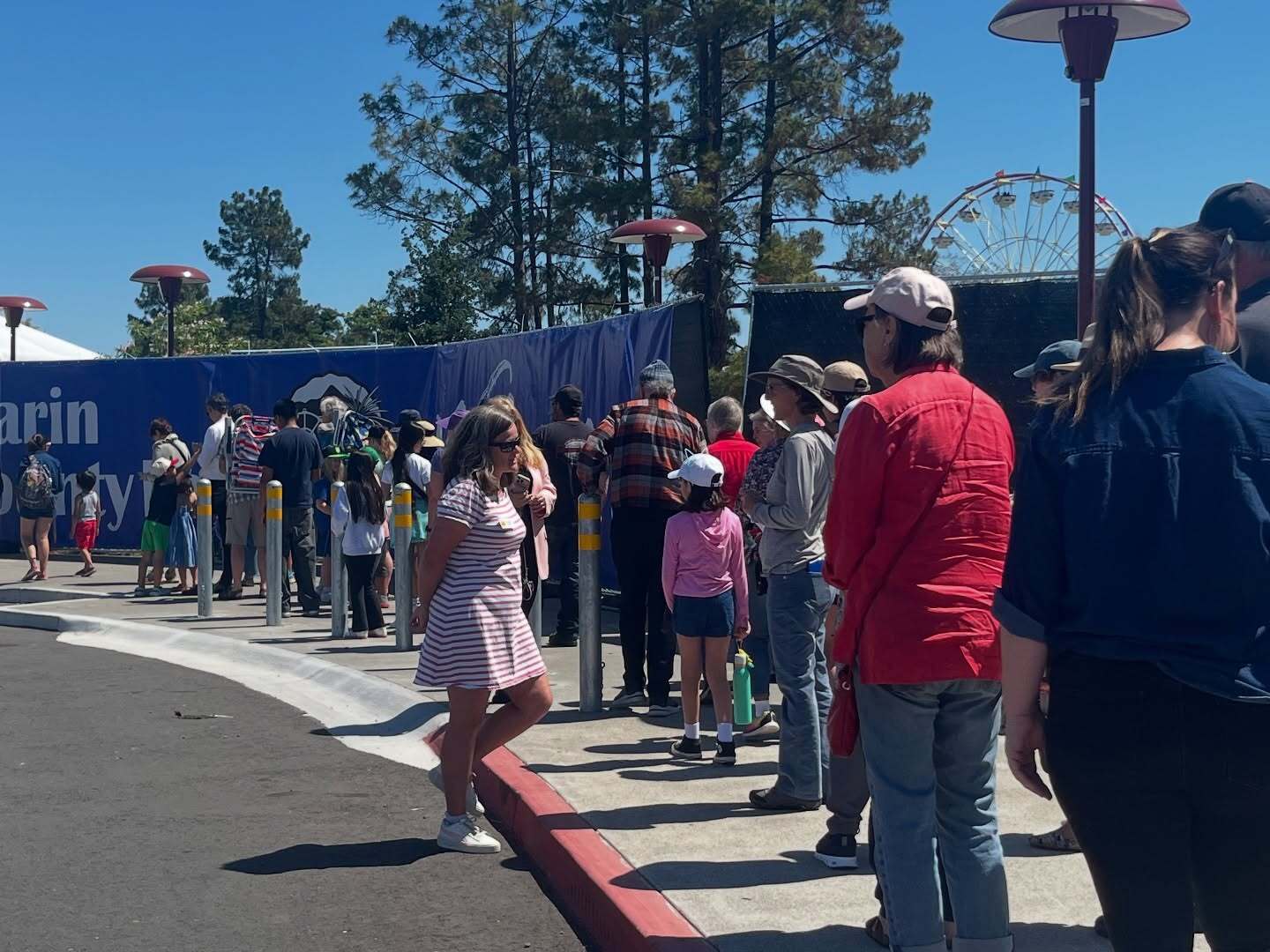 Mary speaking to line in front of Marin County Fair