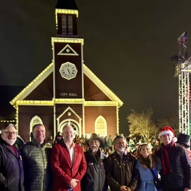 Group of people in front of Novato City Hall at the Novato Tree Lighting Ceremony. 