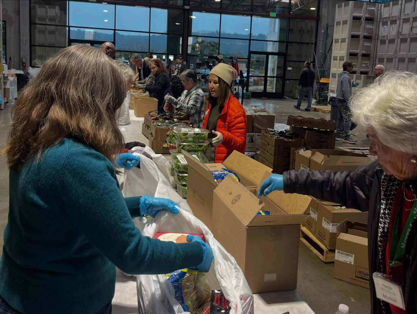 SF Marin Food Bank - Mary Filling Grocery Bags
