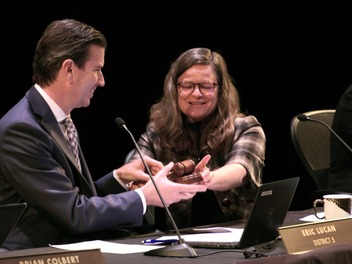 Supervisor Mary Sackett passing the gavel to Supervisor Lucan as he becomes President of the Board of Supervisors. 