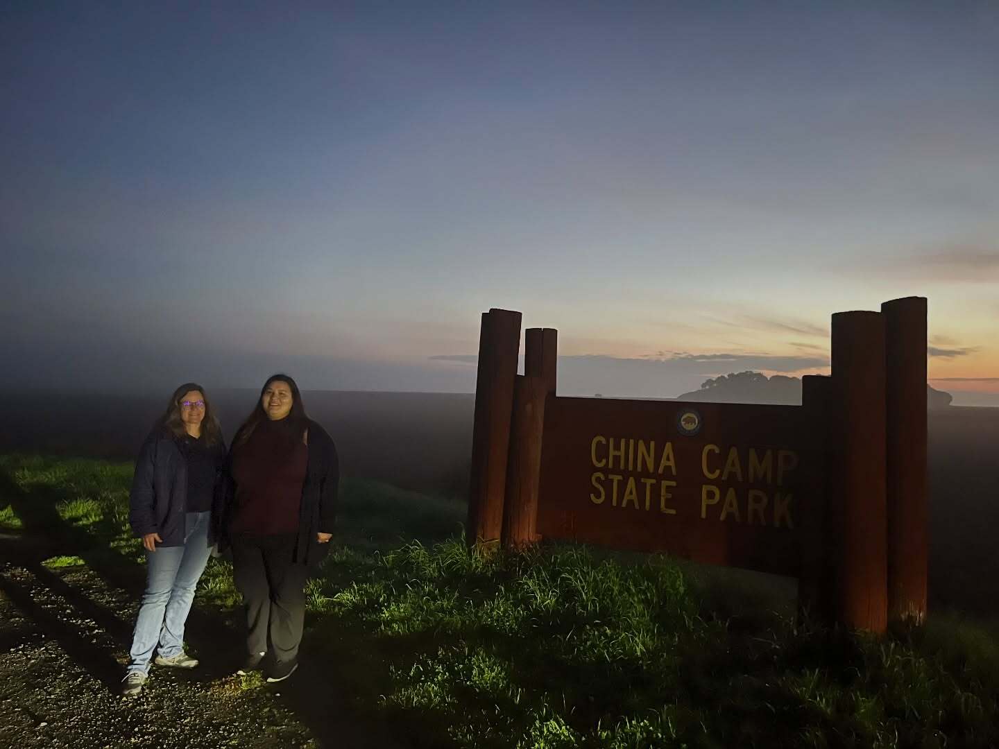 Mary and Crystal standing at China Camp State Park sign during count