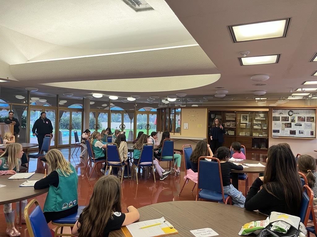 girl scouts talking with Mary in the Civic Center cafeteria