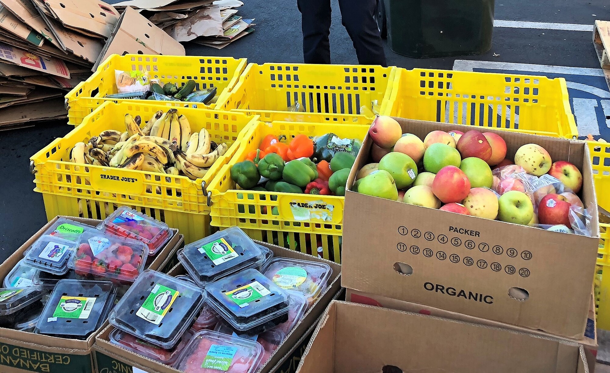 crates of fresh fruit in parking lot