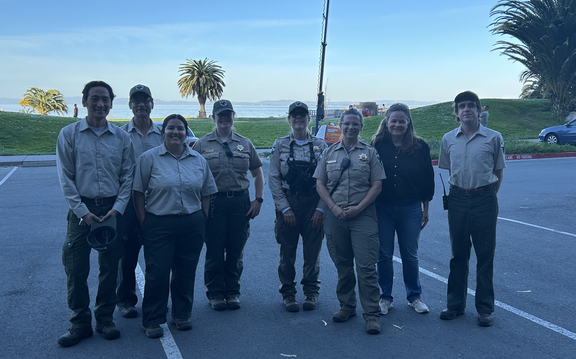 Mary with Parks staff smiling in McNears parking lot