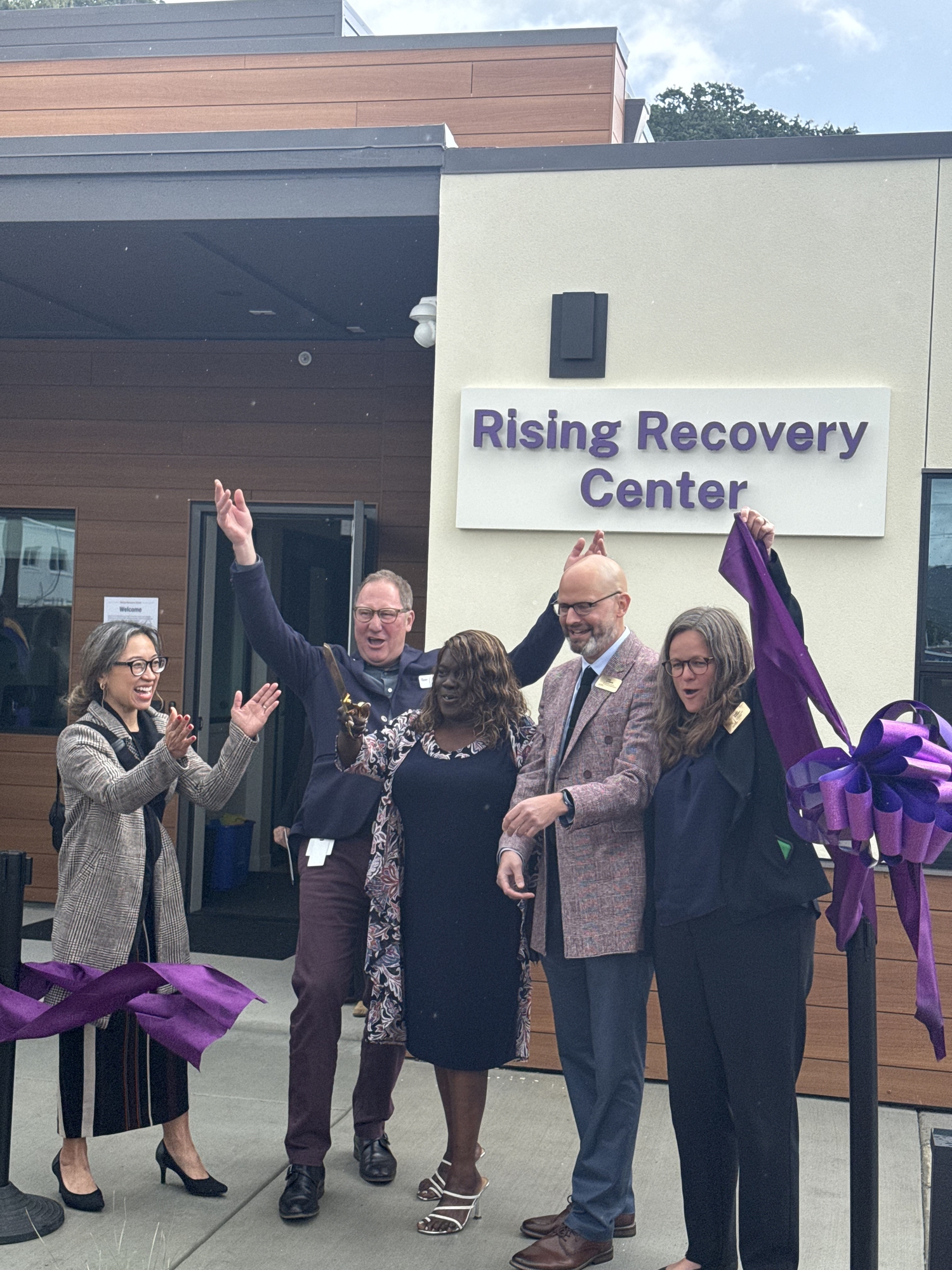 Ritter Center Ribbon Cutting - Mary and others holding up ribbon