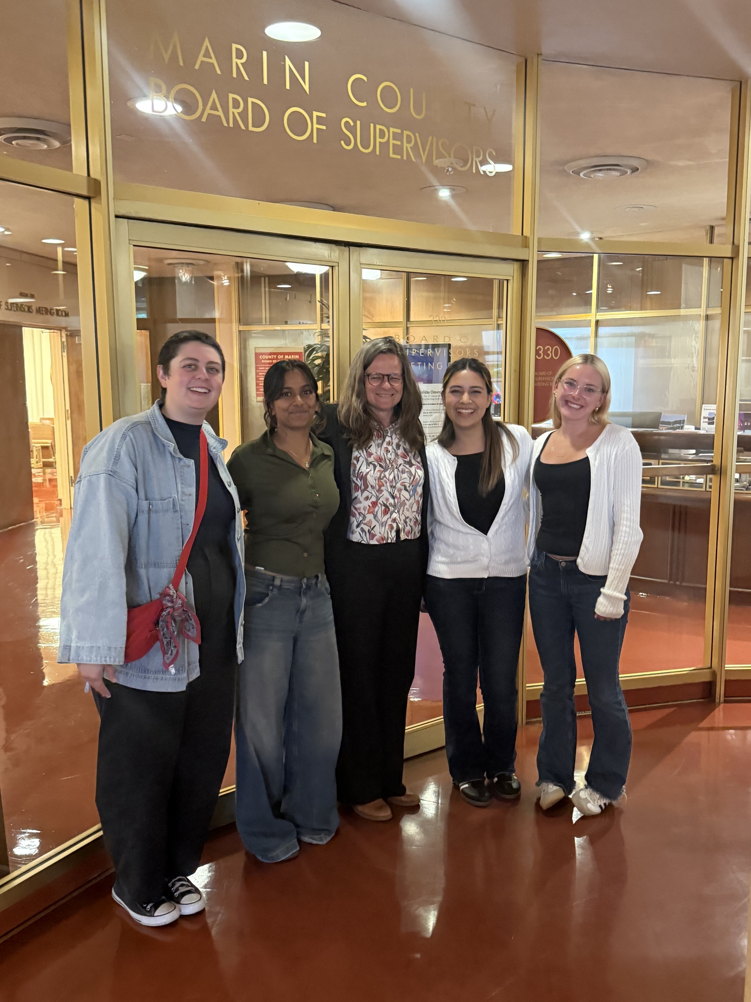 D1 Commissioners standing with Mary in front of Board offices