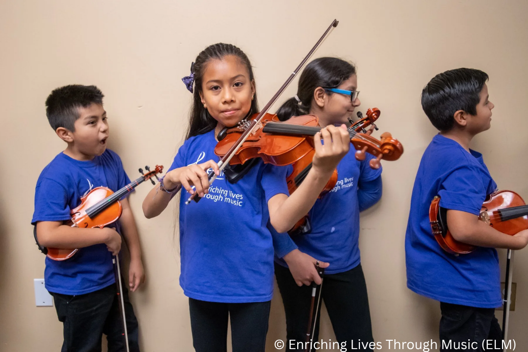 Children holding musical Instruments 