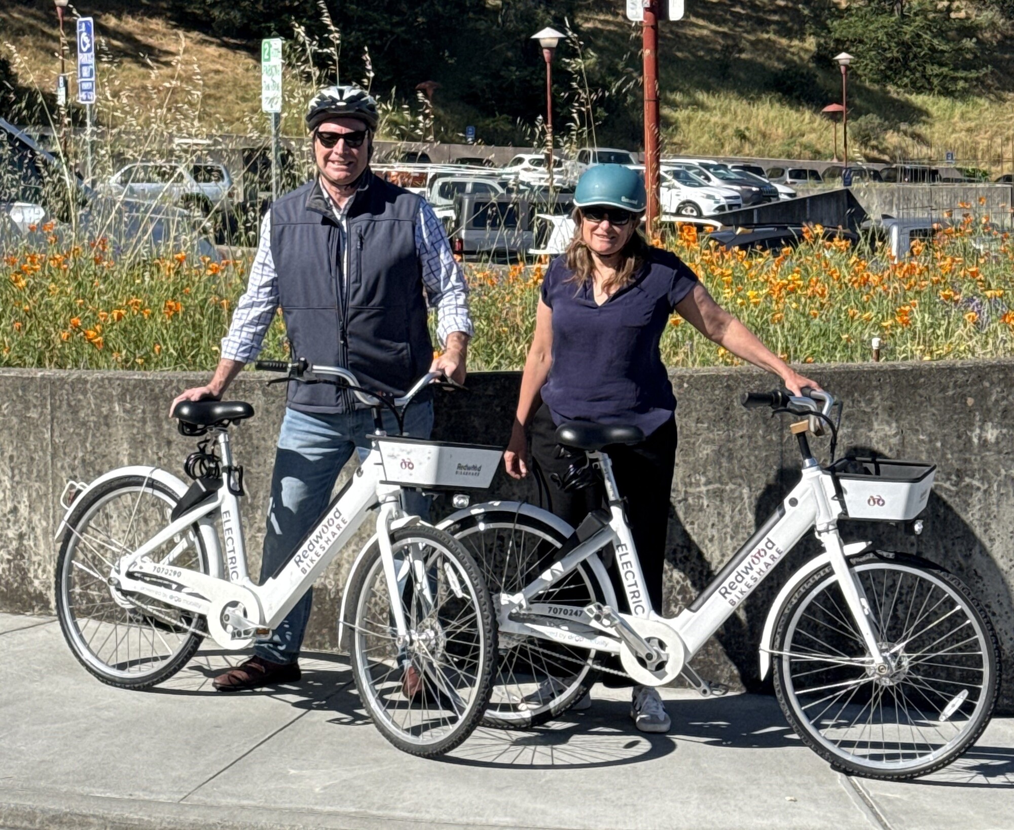 Mary and Damon next to Redwood Bikeshare Bikes