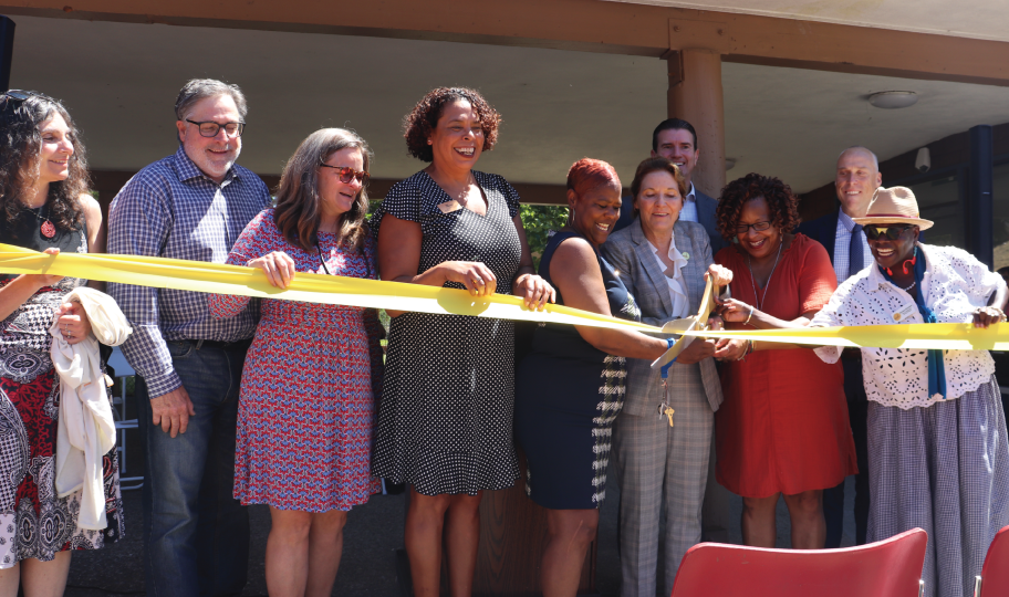 Supervisors and others cutting a ribbon at the Annex