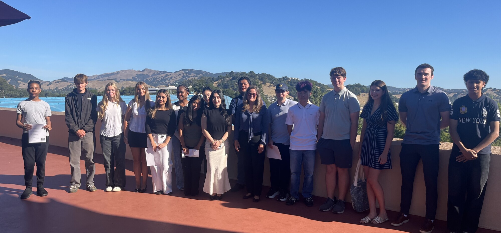 District 1 Job Shadow group of students standing with Mary on Board of Supervisors balcony