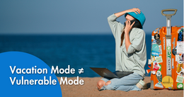 A person sits on a beach with a laptop and sticker-covered suitcase while talking on the phone. Text overlay reads 'Vacation Mode ≠ Vulnerable Mode.
