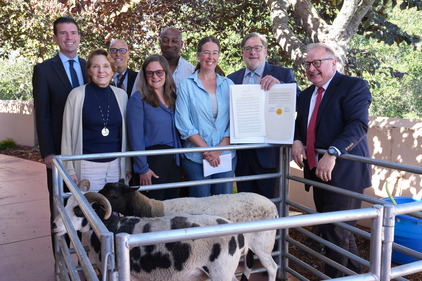 Eric Lucan with fellow Board of Supervisor members, staff and two sheep celebrating Plastic Free July. 