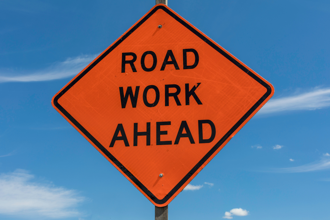 Orange Triangle Road Work Sign
