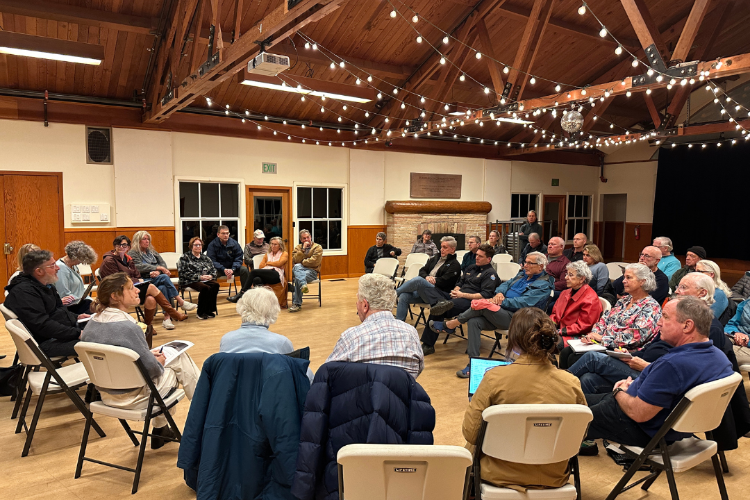 People sitting in a circle in the room 