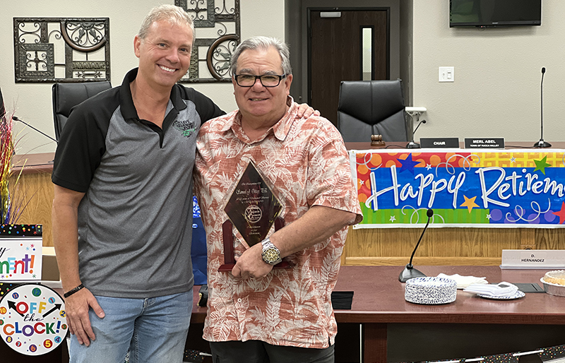 Sam Oktay, right, and Brad Poiriez at Oktay's retirement luncheon on July 29, 2022.