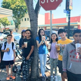 Teens drinking Boba drinks.
