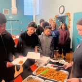 Teens in line to get a meal.