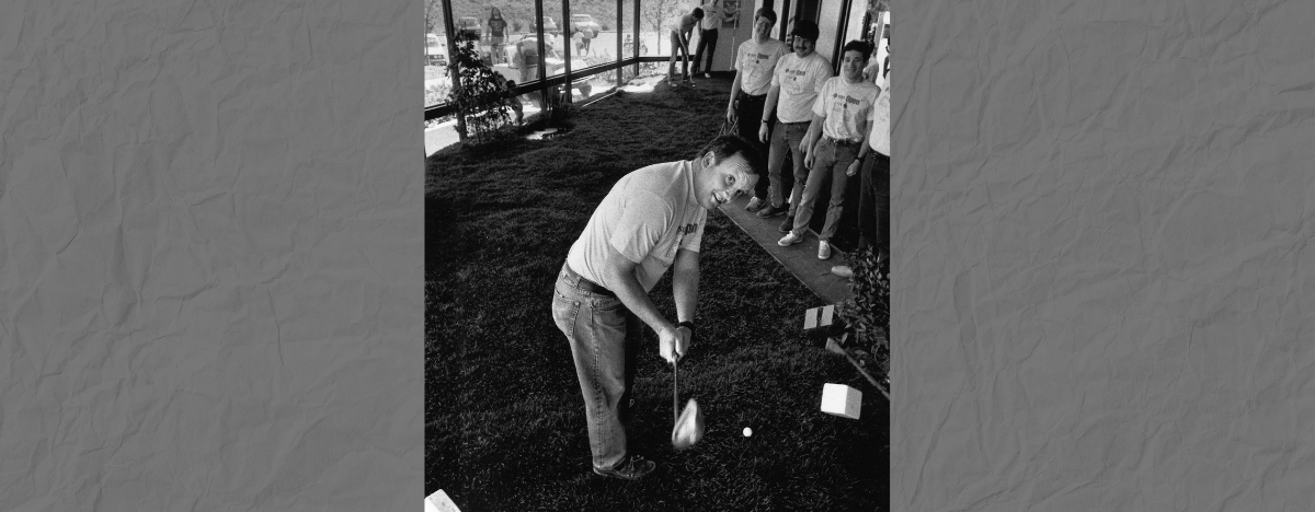 Photo of Suns Microsystems employees playing golf in an office
