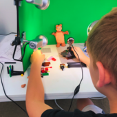 Teen making a stop-motion animation.