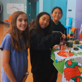 Teens making holiday gifts.