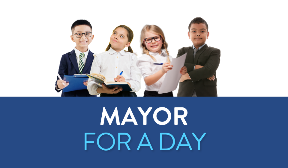 Four kids dressed like professional adults with the words Mayor for a Day