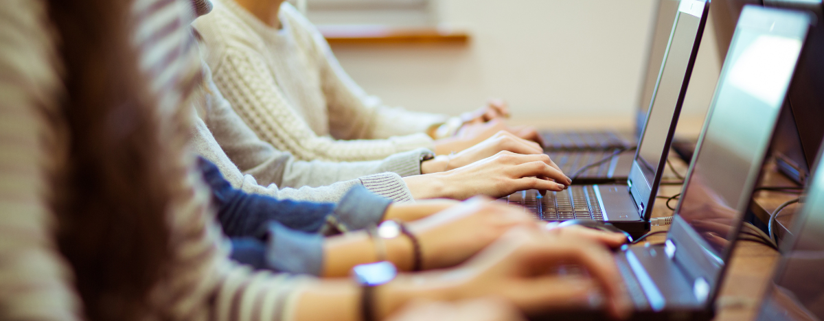 Photo of people working on laptops