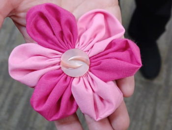 Photo of a sewn fabric flower held in a person's hand