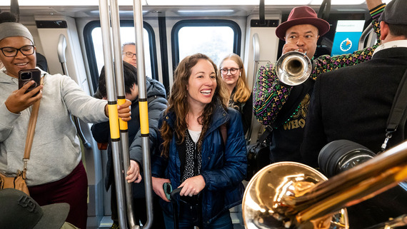 People enjoying themselves on transit.