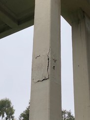 Photo of Severely Corroded Metal Collars on Bridge