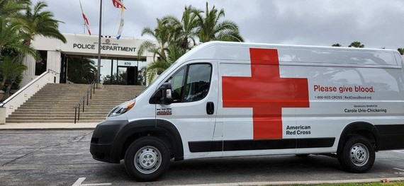 Photo of Red Cross Van in Front of Police Department