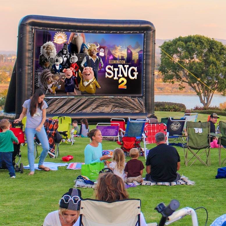 Sing 2 Image with movie goers enjoying it on the screen